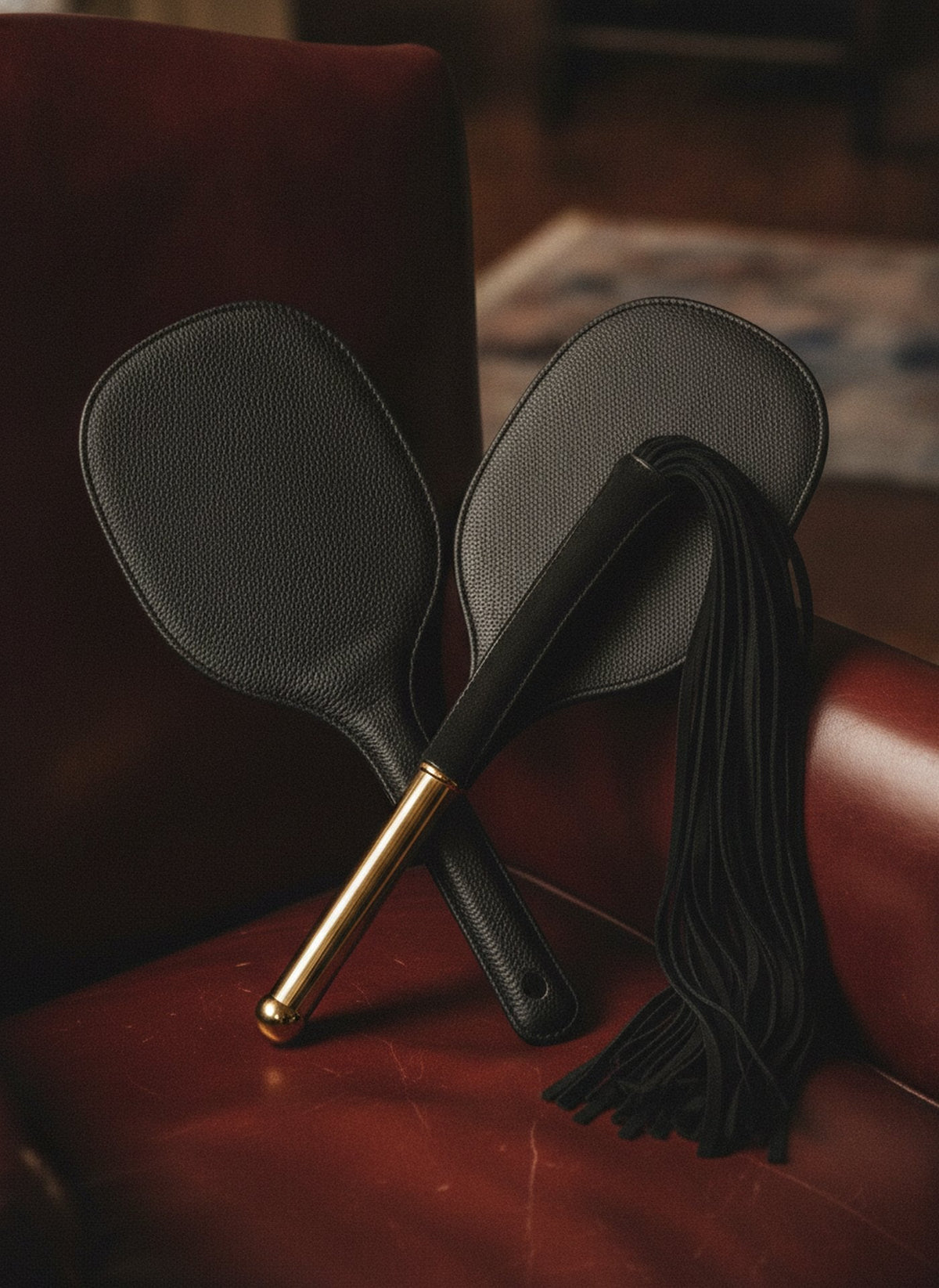 Black and burgundy impact play gear from Atelier BDSM